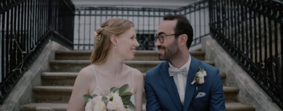 Verena and Ali standing on the garden path of Schloss Miller von Aichholz during their Vienna wedding, captured by an Austria wedding videographer. Hochzeit videograf in Wien